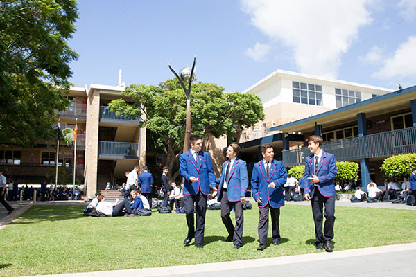 marcellin college Randwick students talking on school lawn